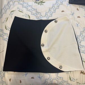 Anthropologie black and white mini skirt with buttons